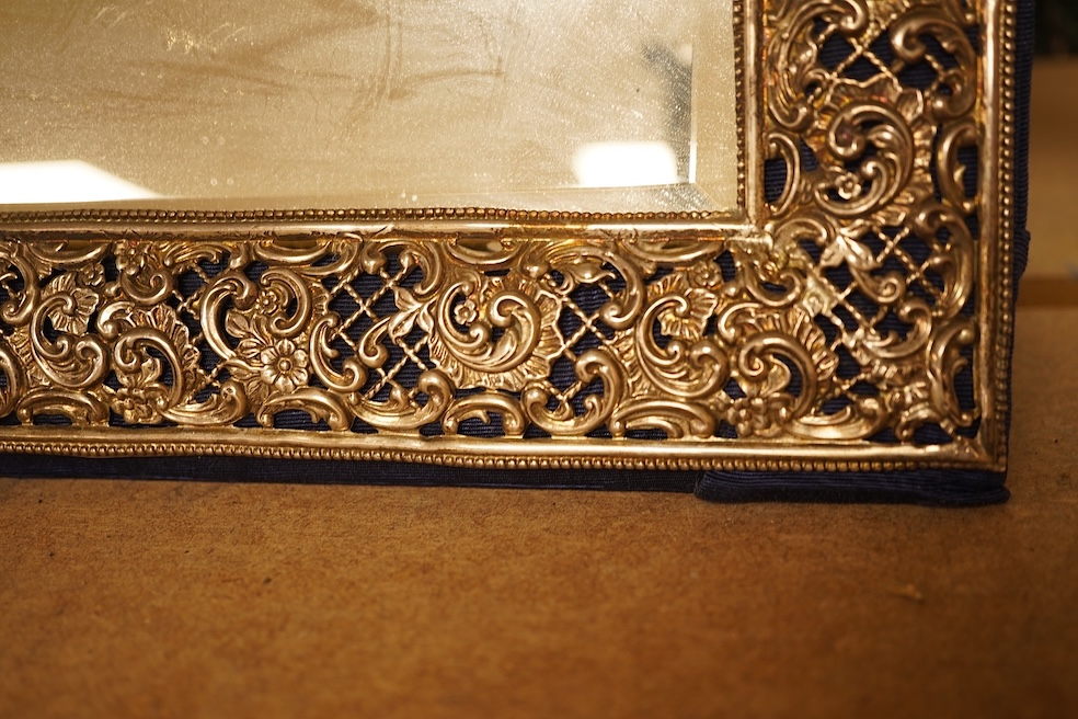 A large late Victorian repousse pierced silver mounted rectangular mirror, Henry Matthews, Birmingham, 1898, 37.4cm by 42.4cm.